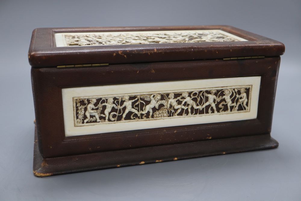 A neo-classical style ivory mounted leather casket, length 31cm